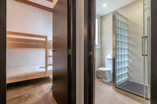 a bathroom with a bunk bed and a toilet at 3BD with private terrace right by Sagrada Familia in Barcelona