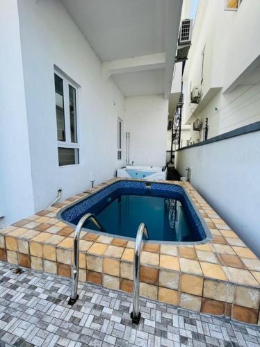 a swimming pool in the middle of a building at Where Luxury Meets Comfort in Lagos