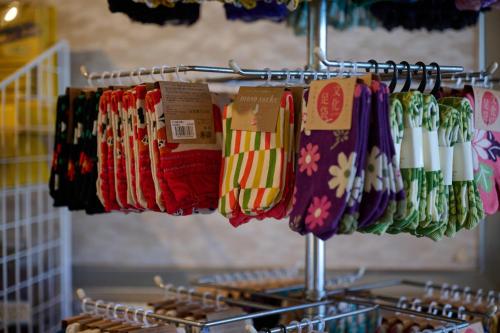a bunch of ties are hanging on a rack at Royal Hotel Kawaguchiko in Fujikawaguchiko