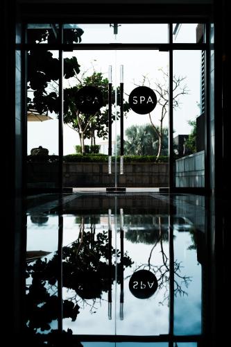 a reflection of a stop sign in a window at JW Marriott Hotel Kolkata in Kolkata