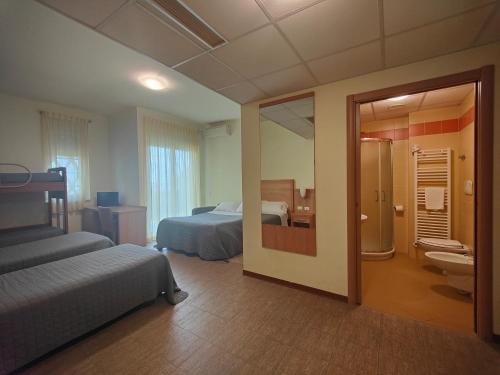 Postel nebo postele na pokoji v ubytování Hotel Foresteria
