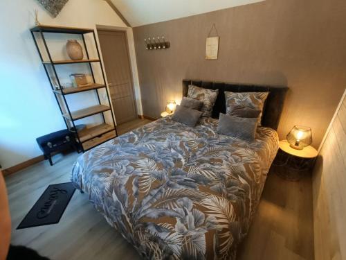 מיטה או מיטות בחדר ב-Apb-Spa cottages et Apb BnB avec piscine