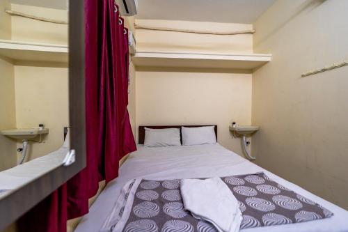 Voodi või voodid majutusasutuse Pondicherry Residency toas