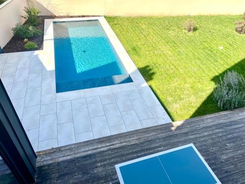 an overhead view of a swimming pool in a yard at Beautiful family home in Poitiers