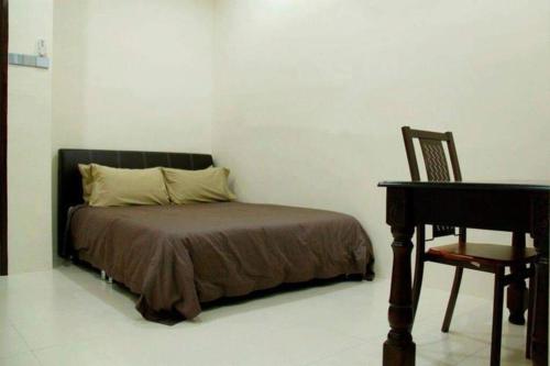 Katil atau katil-katil dalam bilik di Homestay Maya Bukit Kayu Hitam