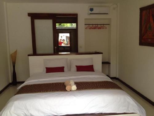 A bed or beds in a room at Alam Mimpi Boutique Hotel