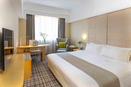 Llit o llits en una habitació de Panda Hotel