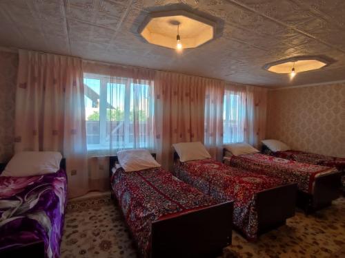 Postel nebo postele na pokoji v ubytování Guesthouse Arnas
