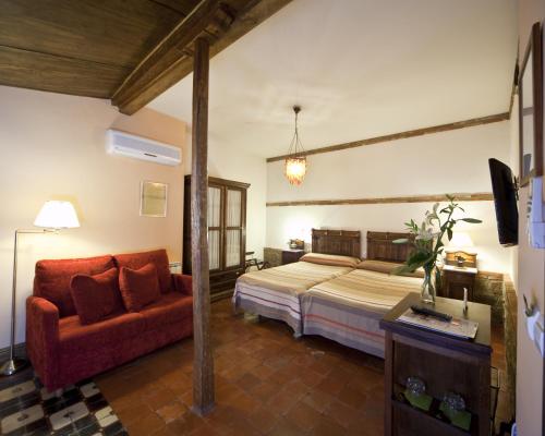 Postel nebo postele na pokoji v ubytování Hotel Boutique La Morada de Juan de Vargas