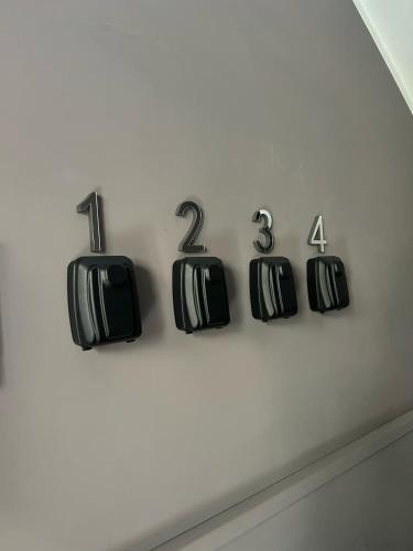 a wall with black numbers on a wall at B&B Il Sogno in Lamezia Terme