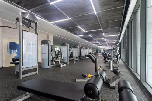 a gym with several treadmills and cardio machines at Yeosu Castle D Art in Yeosu
