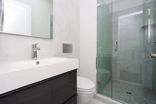 a bathroom with a sink and a toilet and a shower at Modern Studio in Historic Boston - Unit #303 in Boston