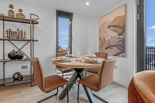a dining room with a table and chairs at Apartment 47 with Free Secure Parking and Onsite Gym in York