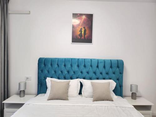 Een bed of bedden in een kamer bij Blueheart-Via Pipera