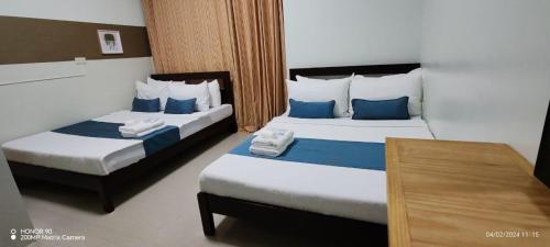 Krevet ili kreveti u jedinici u objektu Kamalig Ng Caraga - Hotel Near SM Mall Butuan powered by Cocotel