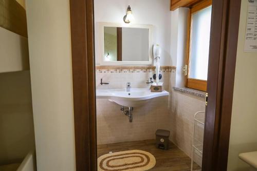 a bathroom with a sink and a mirror at Mamaral in Agerola