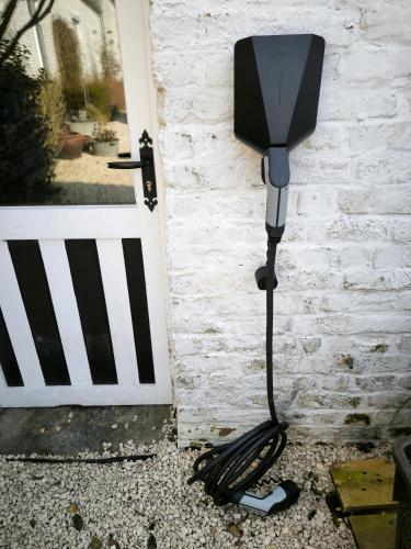 a vacuum cleaner sitting next to a door at La grange de thoricourt in Thoricourt