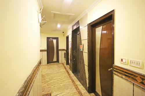 a hallway with a door and a hallwayngth at Hotel Ratandeep at Paharganj in New Delhi