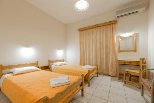 Postel nebo postele na pokoji v ubytování Pink Panther Studios & Apartments