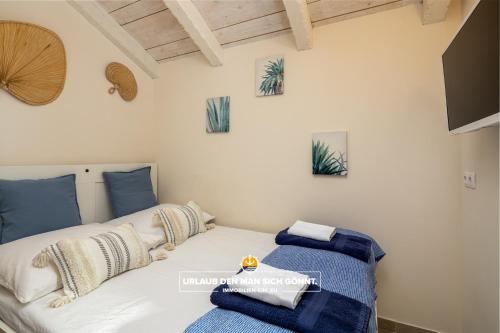 Ένα ή περισσότερα κρεβάτια σε δωμάτιο στο Villa Ohana Krk