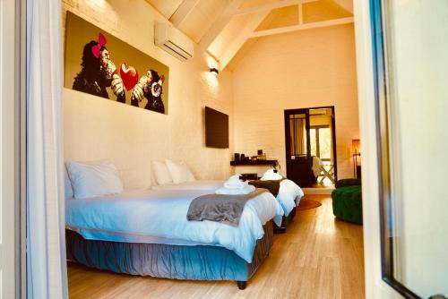 Ένα ή περισσότερα κρεβάτια σε δωμάτιο στο Droom Guesthouse