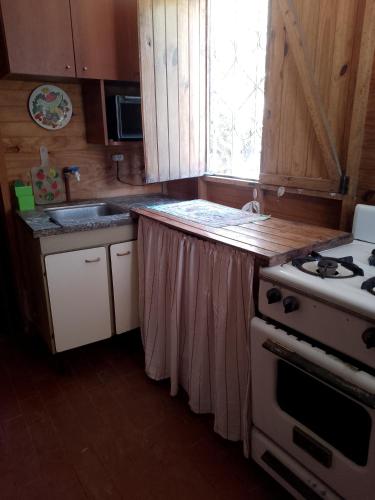 A cozinha ou kitchenette de Cabaña El Mollar