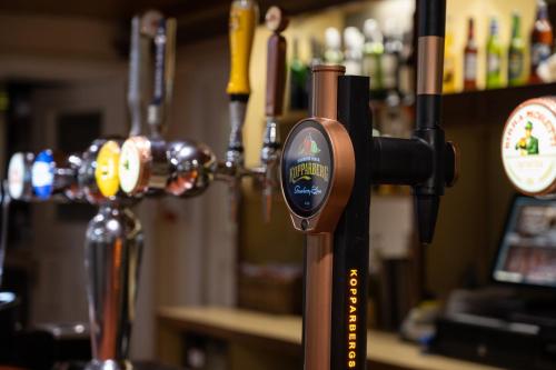 a bottle opener in a bar next to a counter at Pennine Manor Hotel in Huddersfield