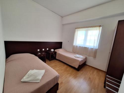 Postel nebo postele na pokoji v ubytování Perla Beach