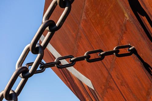 a chain on the side of a wooden door at Hotel ibis Bragança in Bragança