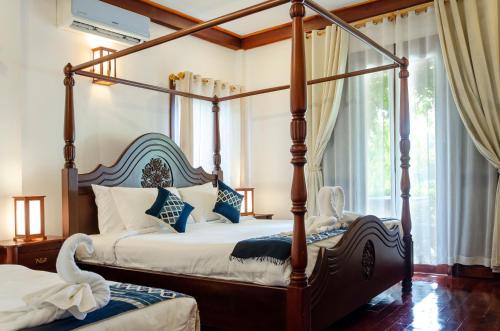 Posteľ alebo postele v izbe v ubytovaní Villa Khili Namkhan