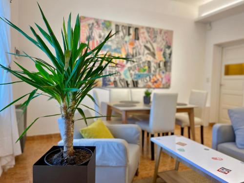 a living room with a potted plant on a table at Patagonia Apartment in Trelew