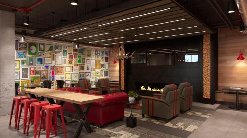 a restaurant with a table and chairs and a fireplace at Stunning 4-BR Houses with On-Site Pool in Bloomington