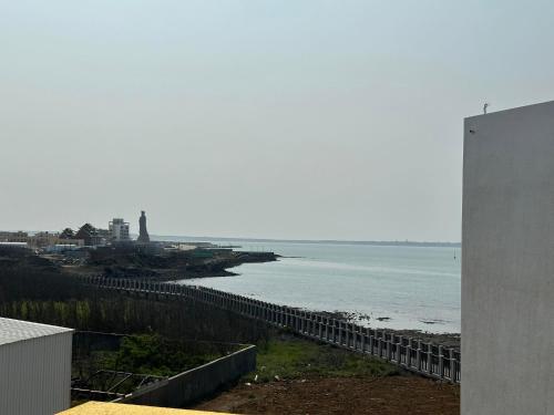 a view of the ocean from a building at Diving Duck B&B in Magong