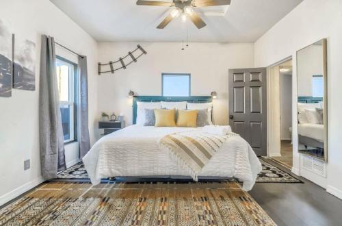 a bedroom with a bed and a ceiling fan at MountainViews FirePit SmartTV AC WD SelfEntry in Colorado Springs