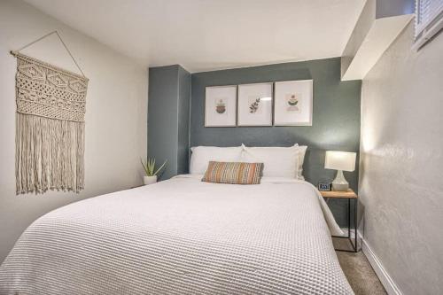 a bedroom with a large white bed in it at Extended Stays & Historic DT Basement Suite in Colorado Springs