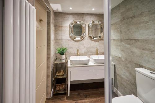 a bathroom with a sink and a mirror at The Believe Boutique (Believe Bar & Bedrooms) in Redcar