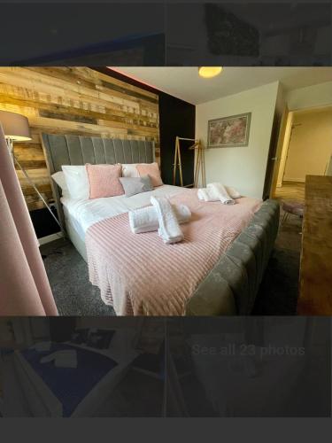 a bedroom with a bed with two towels on it at No 4 Hawthorn View Ground floor apartment in York