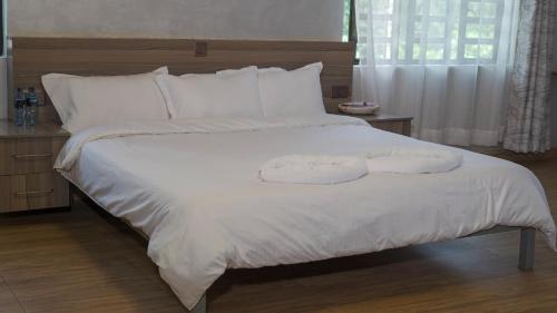 Posteľ alebo postele v izbe v ubytovaní Embu Pazuri Homes