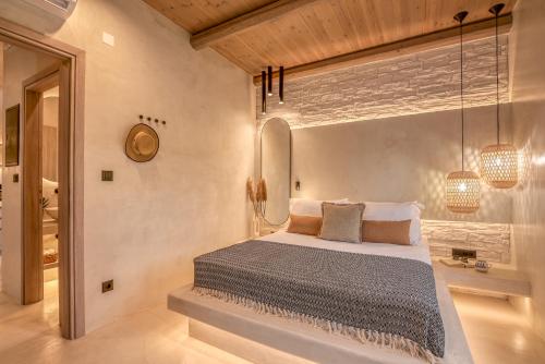 a bedroom with a large bed in a room at Christini Secrets in Plátanos