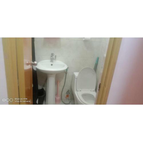 a small bathroom with a sink and a toilet at Homey Studio Condo by Malou in Calamba