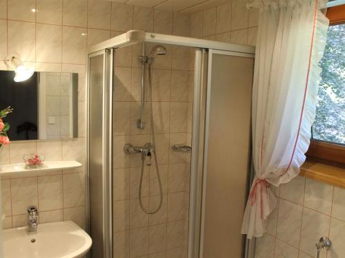 a bathroom with a shower and a sink at Beautiful Holiday Home in Filzmoos with Sauna in Filzmoos