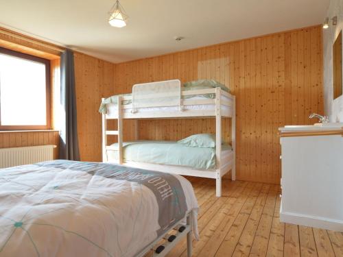 a bedroom with two bunk beds in a room at Spacious Home, Malmedy in Malmedy