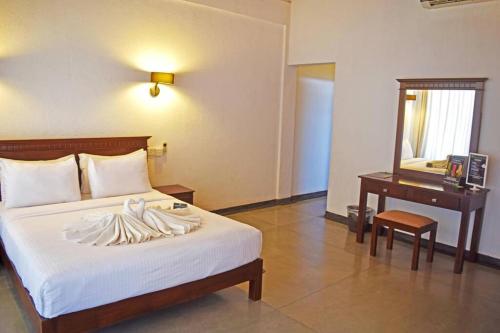 Ένα ή περισσότερα κρεβάτια σε δωμάτιο στο Nilaveli Bay Villa by Ceylon Spaces