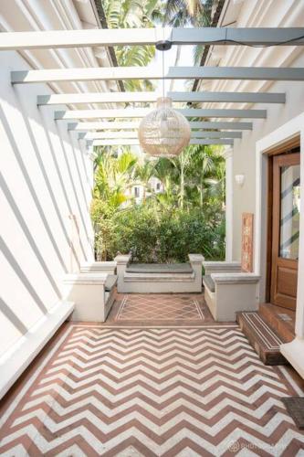 a hallway with a ceiling with a chandelier at Love Story Villas, Baga-Private Pool Villas in Arpora