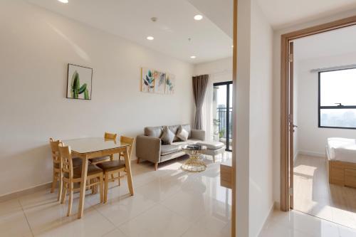 a living room with a couch and a table at SMILE HOME - SOHO APARTMENT COMFORTABLE - BEST LOCATION district 1 in Ho Chi Minh City