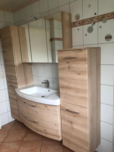 a bathroom with a sink and a mirror at Ferienwohnung Maria in Wimbach