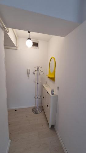 a room with a sink and a mirror on the wall at Airport Residence in Otopeni