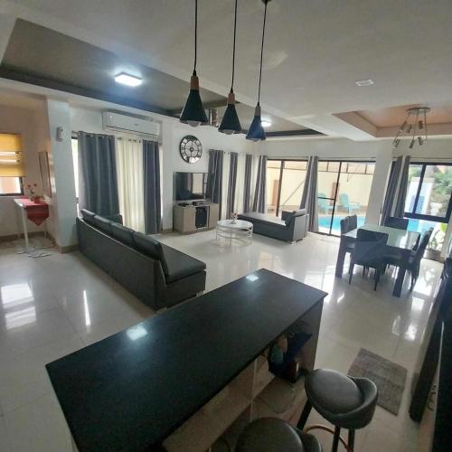 a living room with a couch and a table at Eli's Villa Cebu in Cebu City