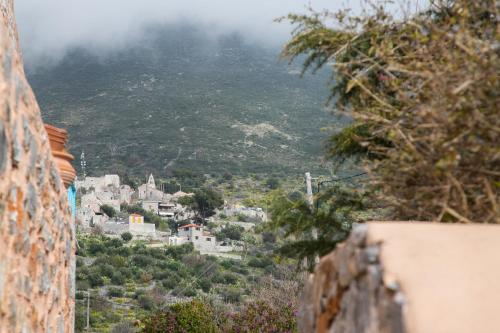 a view of a village from a rock wall at Ktima Karageorgou in Areopolis