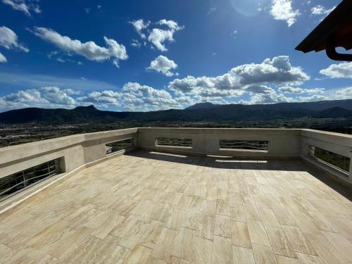 a balcony with a view of the mountains at B&b La Casa Nel Vento in Torpè
